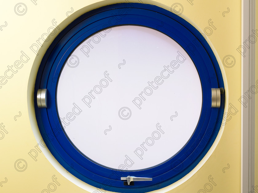 Kent coast-020 
 Porthole. 
 Keywords: window, porthole, blue, modern