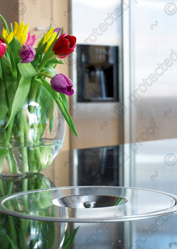 RH kitchenM 
 Tulips in a kitchen. 
 Keywords: tulips, vase, bin, worksurface, fridge, freezer, kitchen