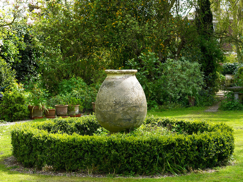 West Malling-6 
 This giant pot came back from Italy in the back of Anne's Mother's car. 
 Keywords: garden Kent flowers flower beds pots scuplture town garden statues box Italy