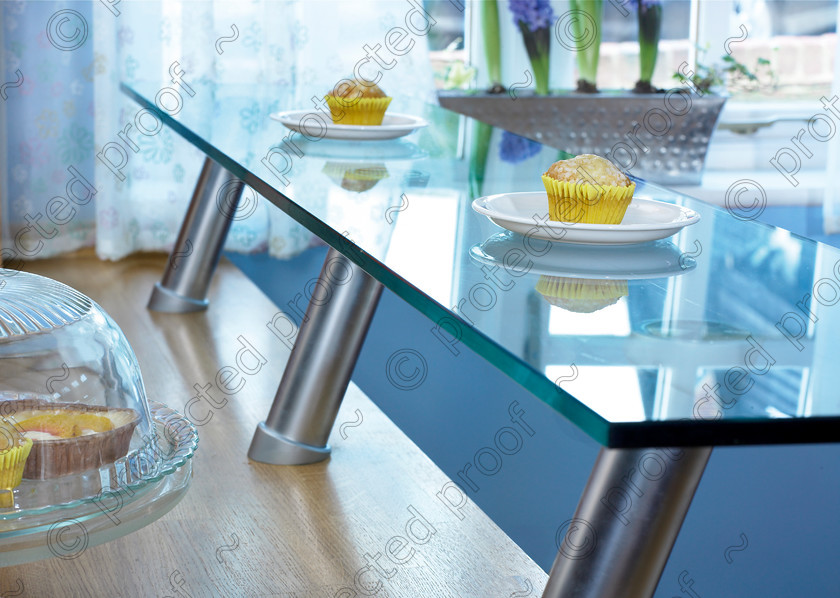 RH kitchenP 
 Cakes on breakfast bar. 
 Keywords: cakes, kitchen, breakfast bar, glass, blue, worksurface